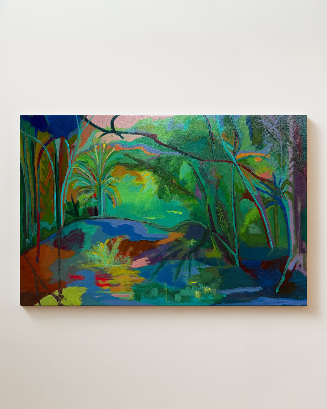 Colorful abstract painting of a forest scene on a white wall. Full view. "Grassy Waters" is an original acrylic landscape painting by Terry Pesso, inspired by the lush color and reflective calm of Florida wetlands. Layered greens, blues, and subtle bursts of light create a sense of movement and depth, blending abstraction with a strong sense of place. This one-of-a-kind artwork is painted on a cradled wood panel and works beautifully as wall art decor. Suitable for framed art or framed wall art.