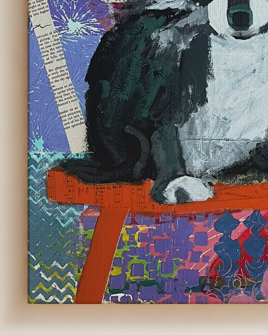 Abstract artwork with a black cat on an orange surface against a colorful background. Detail close-up shot. "Devoted" is an original mixed media painting that captures the soulful presence of a dog against a richly textured, patterned background. Layers of color, collage, and brushwork combine to create depth and emotion, blending realism with abstract design. The expressive eyes and thoughtful pose bring warmth and personality to the piece, making it a perfect addition for dog lovers and collectors of cont