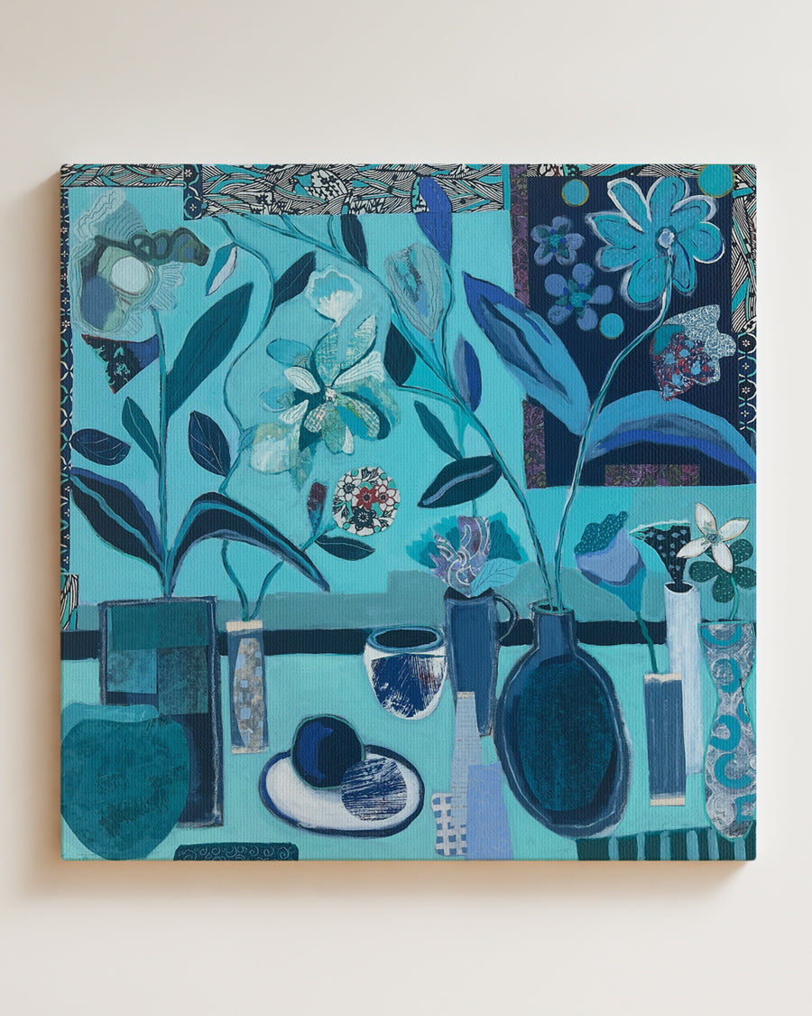 Canvas print with a blue and green floral and still life design on a white wall. Full view. An original still life artwork and contemporary painting by Terry Pesso inspired by everyday objects, vessels, and quiet moments. These expressive works elevate ordinary subjects into refined wall art decor and are suitable for framed art and framed wall art.