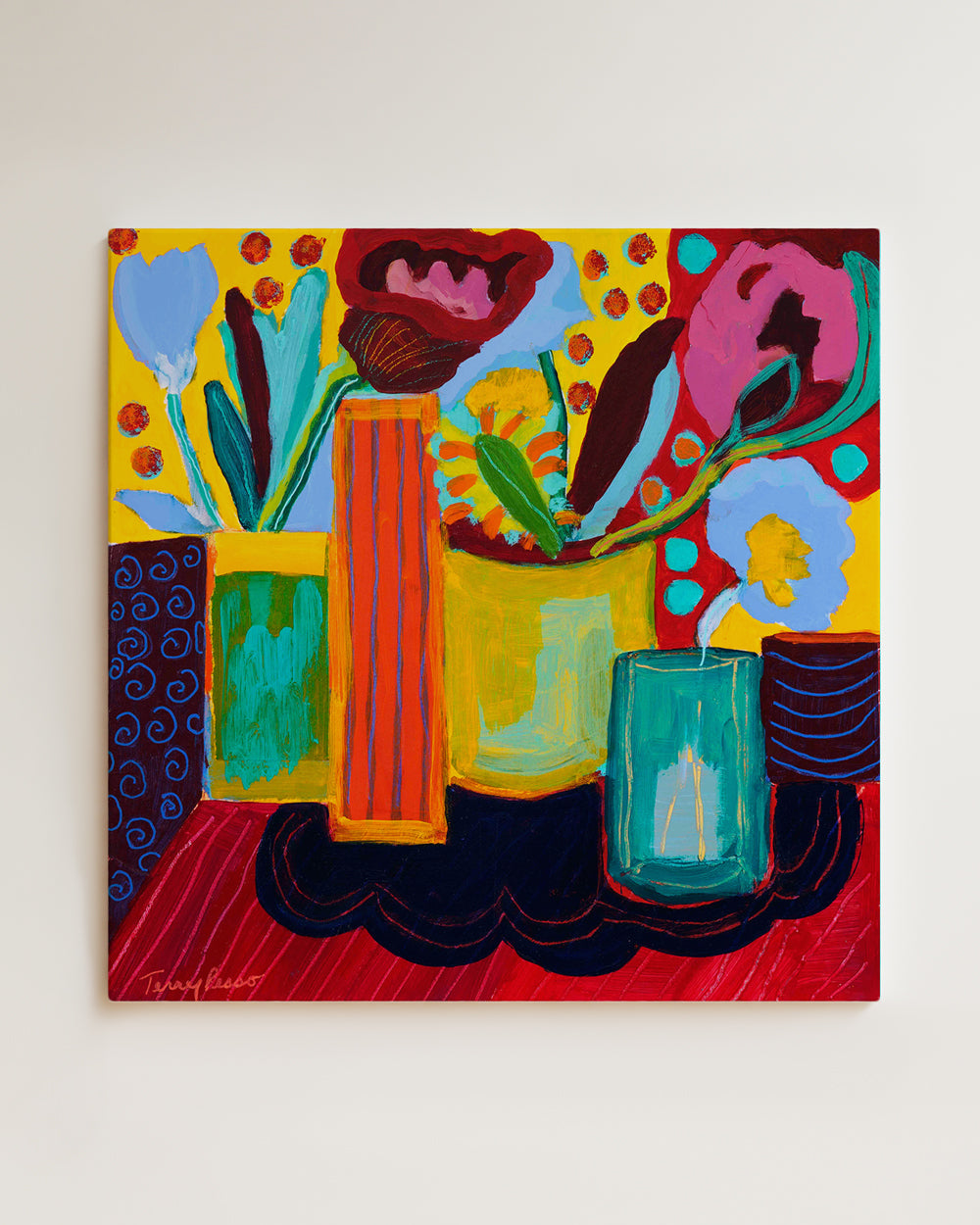 Colorful abstract painting with floral elements on a white wall. Wood panel shown hanging on wall. An original still life artwork and contemporary painting by Terry Pesso inspired by everyday objects, vessels, and quiet moments. These expressive works elevate ordinary subjects into refined wall art decor and are suitable for framed art and framed wall art.