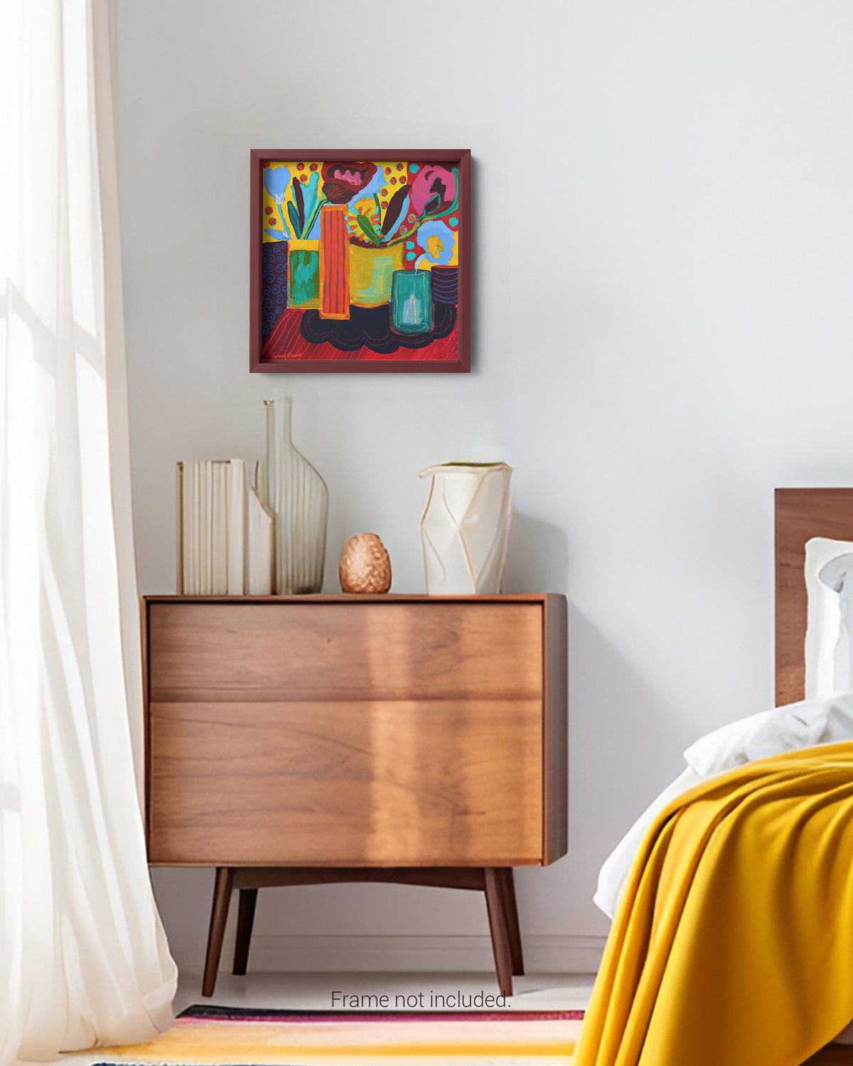 Wooden nightstand with decorative items and a colorful abstract painting on a white wall. An original wooden panel still life artwork and contemporary painting by Terry Pesso inspired by everyday objects, vessels, and quiet moments. These expressive works elevate ordinary subjects into refined wall art decor and are suitable for framed art and framed wall art.