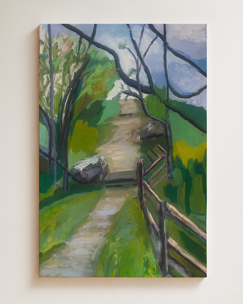 Painting of a path leading through a forest with a wooden fence on shown on a beige wall. Shop original landscape artwork and contemporary painting by Terry Pesso that blends abstraction, memory, and natural rhythm. These expressive works use layered color and motion to create dramatic wall art decor and are ideal for framed art and framed wall art presentation.