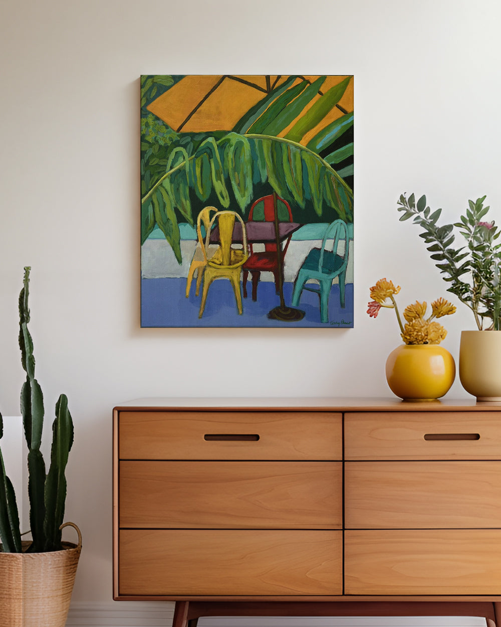 Colorful abstract painting above a wooden dresser with decorative items on canvas. Lifestyle mockup view. Original interior and garden artwork and contemporary painting by Terry Pesso inspired by everyday spaces, patios, and outdoor living. These expressive works transform familiar scenes into modern wall art decor and are suitable for framed art and framed wall art.