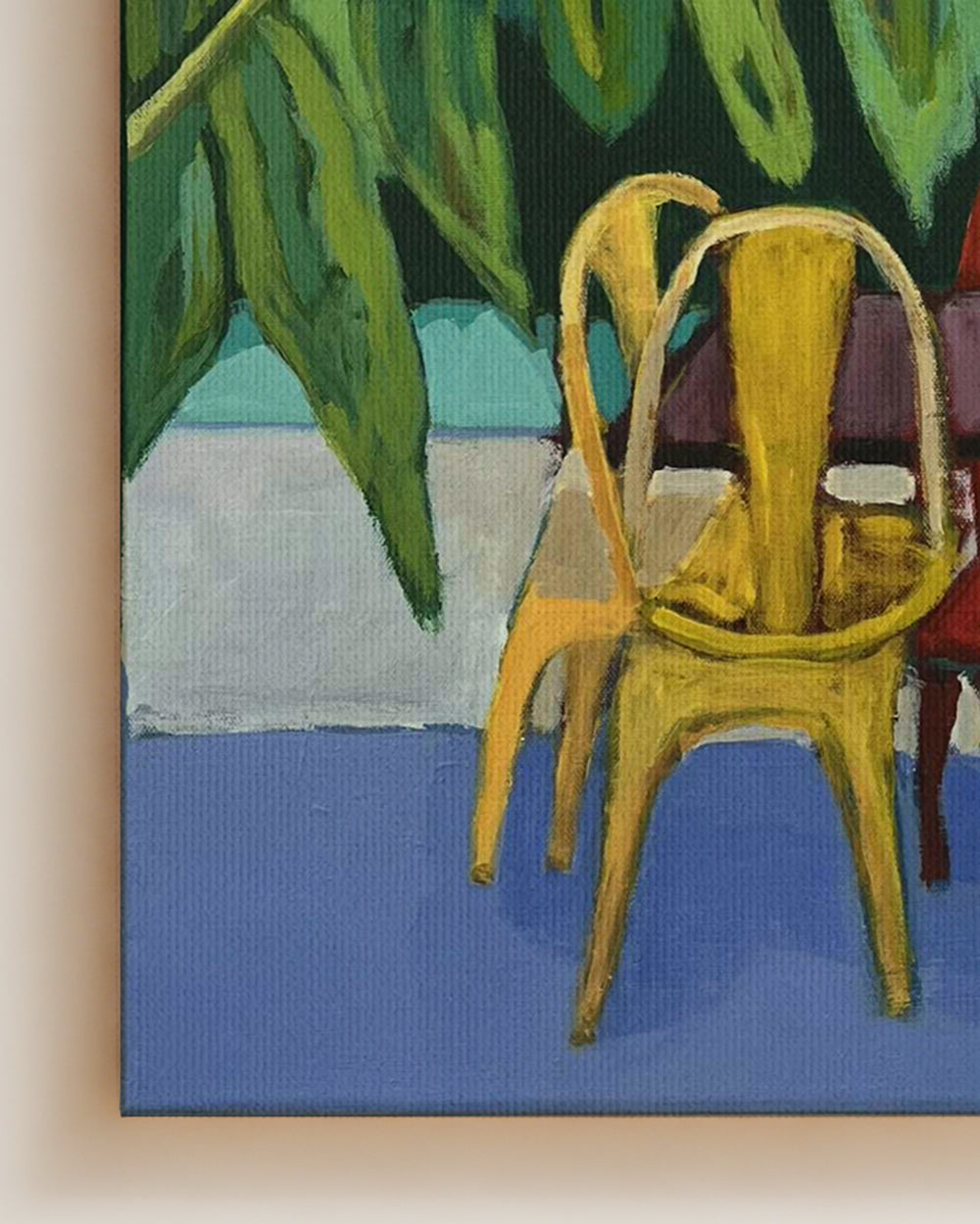 Painting of a yellow chair and table with green foliage in the background on canvas. Detail closeup shot. Original interior and garden artwork and contemporary painting by Terry Pesso inspired by everyday spaces, patios, and outdoor living. These expressive works transform familiar scenes into modern wall art decor and are suitable for framed art and framed wall art.