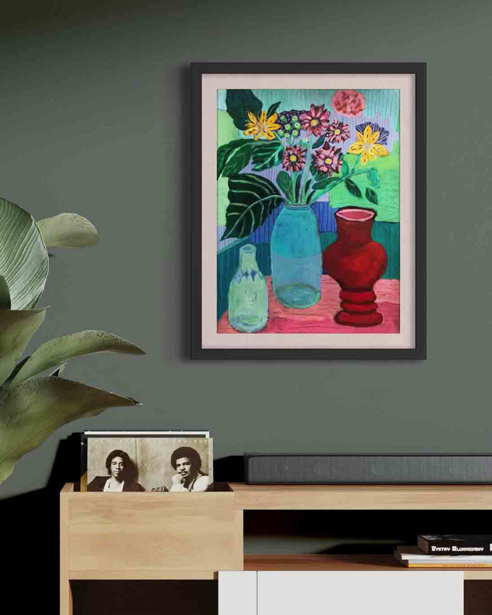Framed mockup artwork of flowers and vases on a wall above a wooden shelf. An original still life artwork and contemporary painting by Terry Pesso inspired by everyday objects, vessels, and quiet moments. These expressive works elevate ordinary subjects into refined wall art decor and are suitable for framed art and framed wall art.