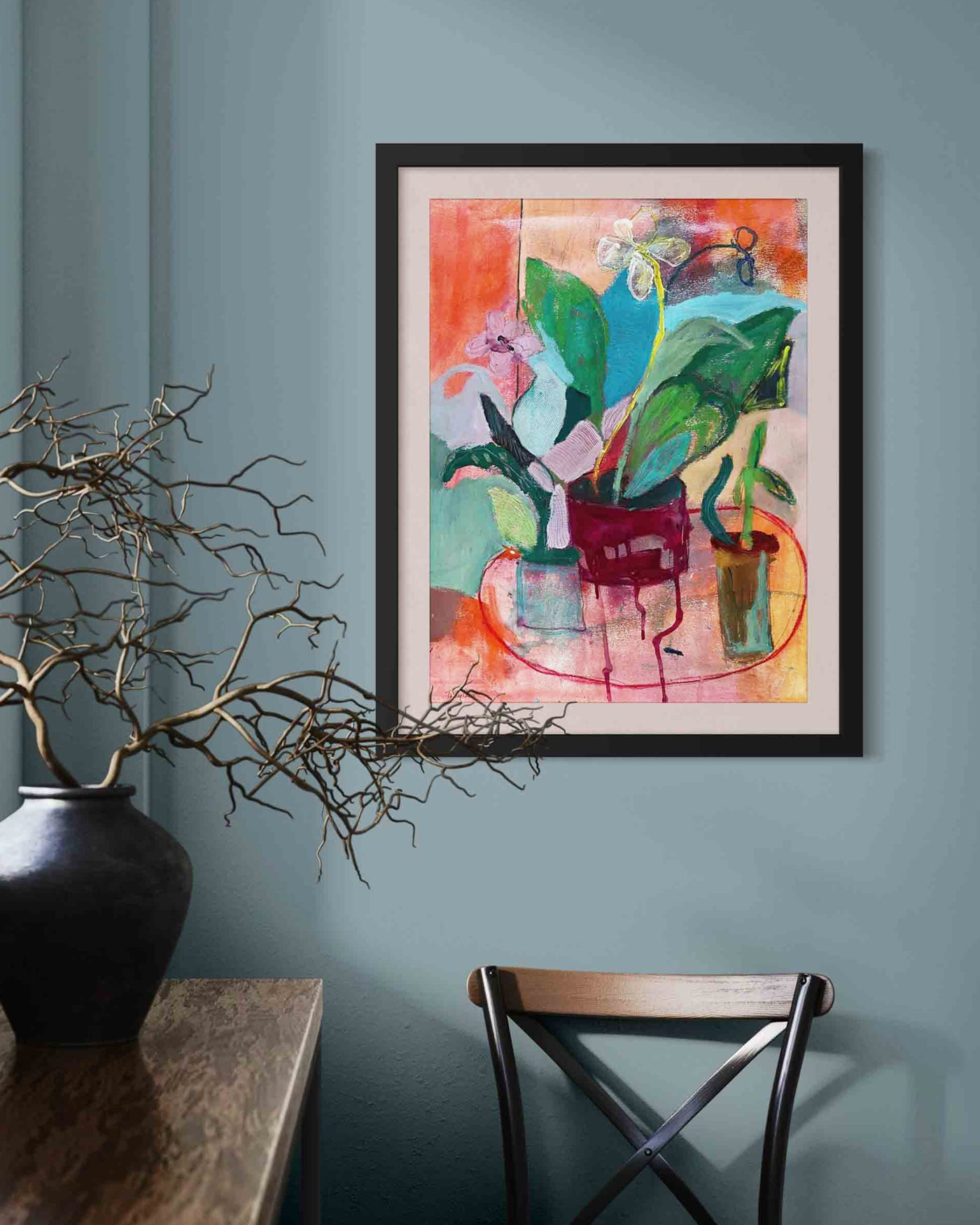 Framed abstract artwork on a wall with a table and chair in the foreground. An original still life artwork and contemporary painting by Terry Pesso inspired by everyday objects, vessels, and quiet moments. These expressive works elevate ordinary subjects into refined wall art decor and are suitable for framed art and framed wall art.